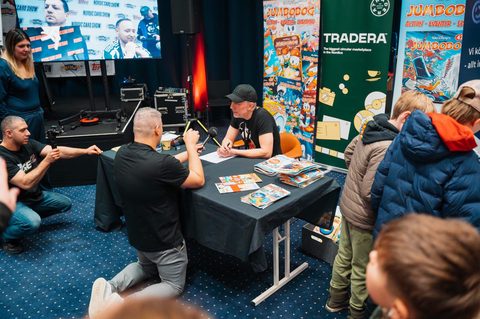 Content creators filming and streaming at a card show