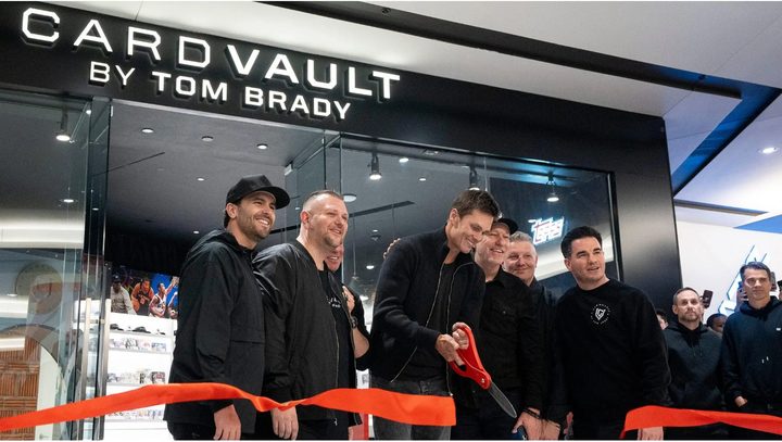 Tom Brady cutting the ribbon at a CardVault by Tom Brady store opening